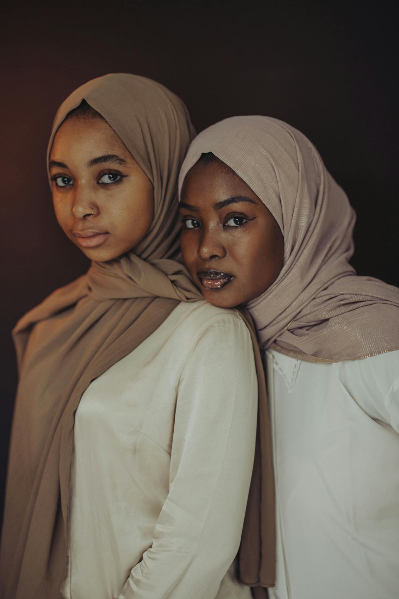 Beautiful portrait of two women in hijabs showcasing diversity and elegance.